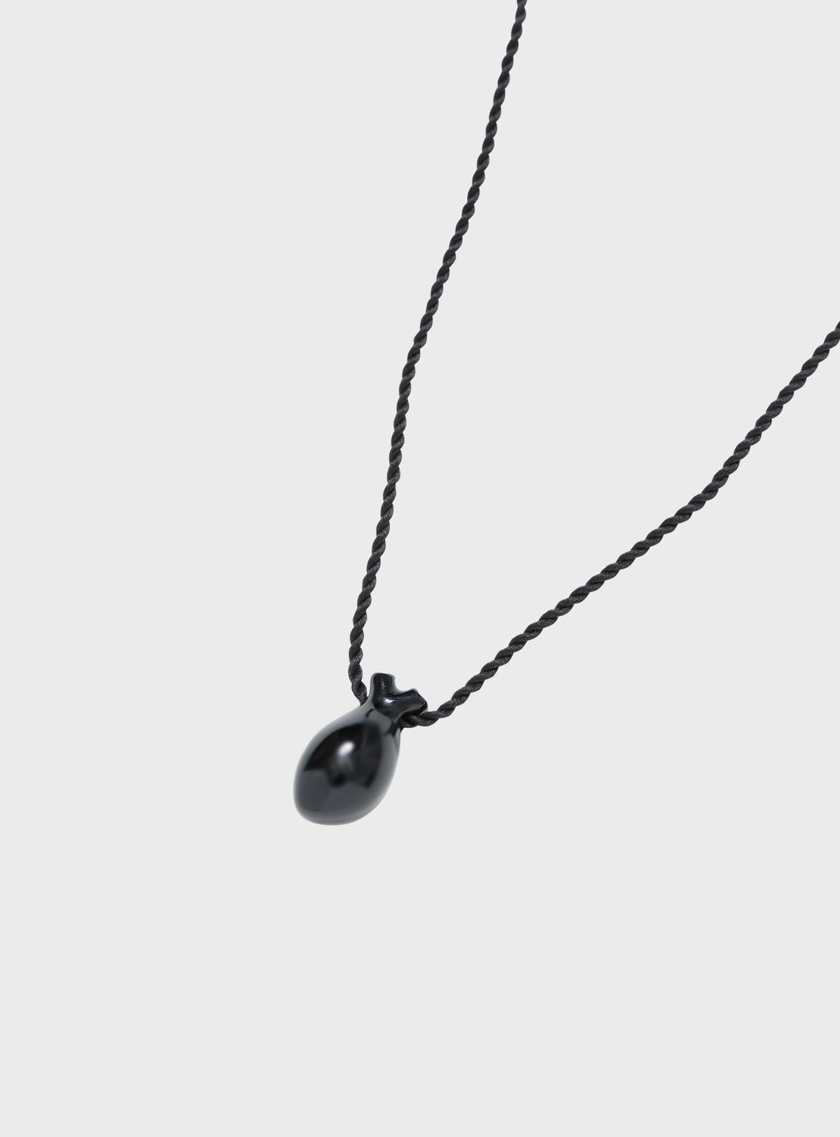 Onyx heart with silk cord